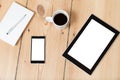 Tablet and smartphone on wooden floor