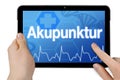Tablet with touchscreen and the german word for acupunctre Royalty Free Stock Photo