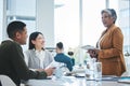 Tablet, training and manager in a meeting with employees speaking about business growth or development in an office Royalty Free Stock Photo