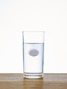 Tablet water glass table Royalty Free Stock Photo