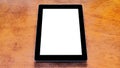 Tablet with white empty screen on wooden desk Royalty Free Stock Photo