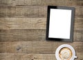 Tablet white screen display and coffee on old wood background