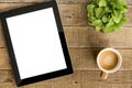Tablet white screen display and coffee on table Royalty Free Stock Photo