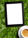 Tablet white screen similar to ipad display and coffee Royalty Free Stock Photo