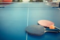 Tabletennis or ping pong rackets and balls on table. Sport concept