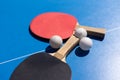 Tabletennis or ping pong rackets and balls on table. Sport concept.