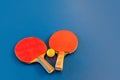 Tabletennis or ping pong rackets and balls on table.