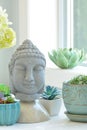 Tabletop Buddah with plants vertical Royalty Free Stock Photo