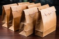 Tabletop display: Brown paper bags laid out neatly on the surface.