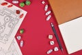 Tabletop role playing flat lay with RPG game dices, hand drawn dungeon map, rule books and pen on red background Royalty Free Stock Photo