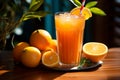 A tabletop tableau glass of orange juice, blue straw, and a heap of oranges