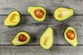 Tabletop view - arranged avocado halves, some of them with the s