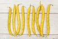 Tabletop view - yellow string wax beans on white boards Royalty Free Stock Photo