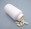 Tablets of Amino Acids and White Plastic Can