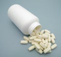 Tablets of Amino Acids and White Plastic Can