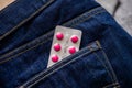 Tablets in blister in jeans pocket. The concept of antidepressants and healing