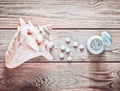 Tablets of calcium and shell on a wooden table. Medical concept. Royalty Free Stock Photo