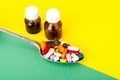 Tablets, capsules, pills in spoon on bright background. The concept of medicine and health Royalty Free Stock Photo
