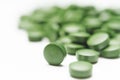 Tablets of Chlorella - green algae Royalty Free Stock Photo