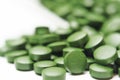 Tablets of Chlorella - green algae Royalty Free Stock Photo