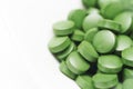 Tablets of Chlorella - green algae Royalty Free Stock Photo
