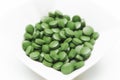 Tablets of Chlorella - green algae Royalty Free Stock Photo