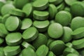 Tablets of Chlorella - green algae Royalty Free Stock Photo