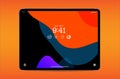 Tablet with coloured screen savers isolated on orange background.Mockup of realistic and detailed dev