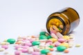 Tablets in the glass bottle on a white background