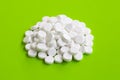 Tablets of Paracetamol on green background