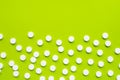 Tablets of Paracetamol on green background