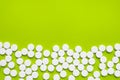 Tablets of Paracetamol on green background