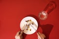 Tablets, pills and capsules on a white porcelain plate. The table is set with a plate Royalty Free Stock Photo