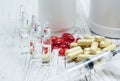 Tablets, pills and syringe of doping drugs or medicine with russian tape flag