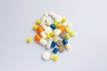 Tablets and pills on the white table Royalty Free Stock Photo