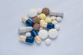 Tablets and pills on the white table Royalty Free Stock Photo