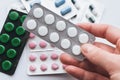 10 tablets in a silver blister in hand on a white background close-up. The concept of medication Royalty Free Stock Photo