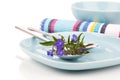 Tableware with blue lobelia flowers and cutlery Royalty Free Stock Photo