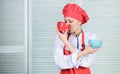 Tableware choice. culinary cuisine. girl in apron and hat hold bowls. cook in restaurant, uniform. professional chef