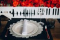 Tableware Glasses, flower fork, knife served for dinner in restaurant with cozy interior