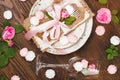 Tableware with light pink roses and meringues Royalty Free Stock Photo