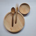 tableware made of wood in the form of plates, spoons and forks Royalty Free Stock Photo