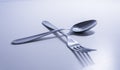Fork and a spoon in a white background Royalty Free Stock Photo