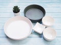 Tableware set with ceramics empty round dish plate and bowl cup on wooden table Royalty Free Stock Photo