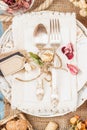 Tableware and silverware with dry flowers, top view