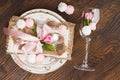 Tableware and silverware with puffy light pink roses Royalty Free Stock Photo