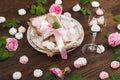 Tableware and silverware with puffy light pink roses Royalty Free Stock Photo