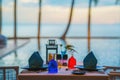 Tableware on table ready for dinner at poolside and seaside restaurant Royalty Free Stock Photo