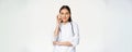 Taboo, medical confidentiality concept. Young asian doctor, female physician showing mouth silence, taboo or zip gesture Royalty Free Stock Photo