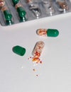 Tabs Vitamins, omega 3, Medications tablets and capsules in a beaker.